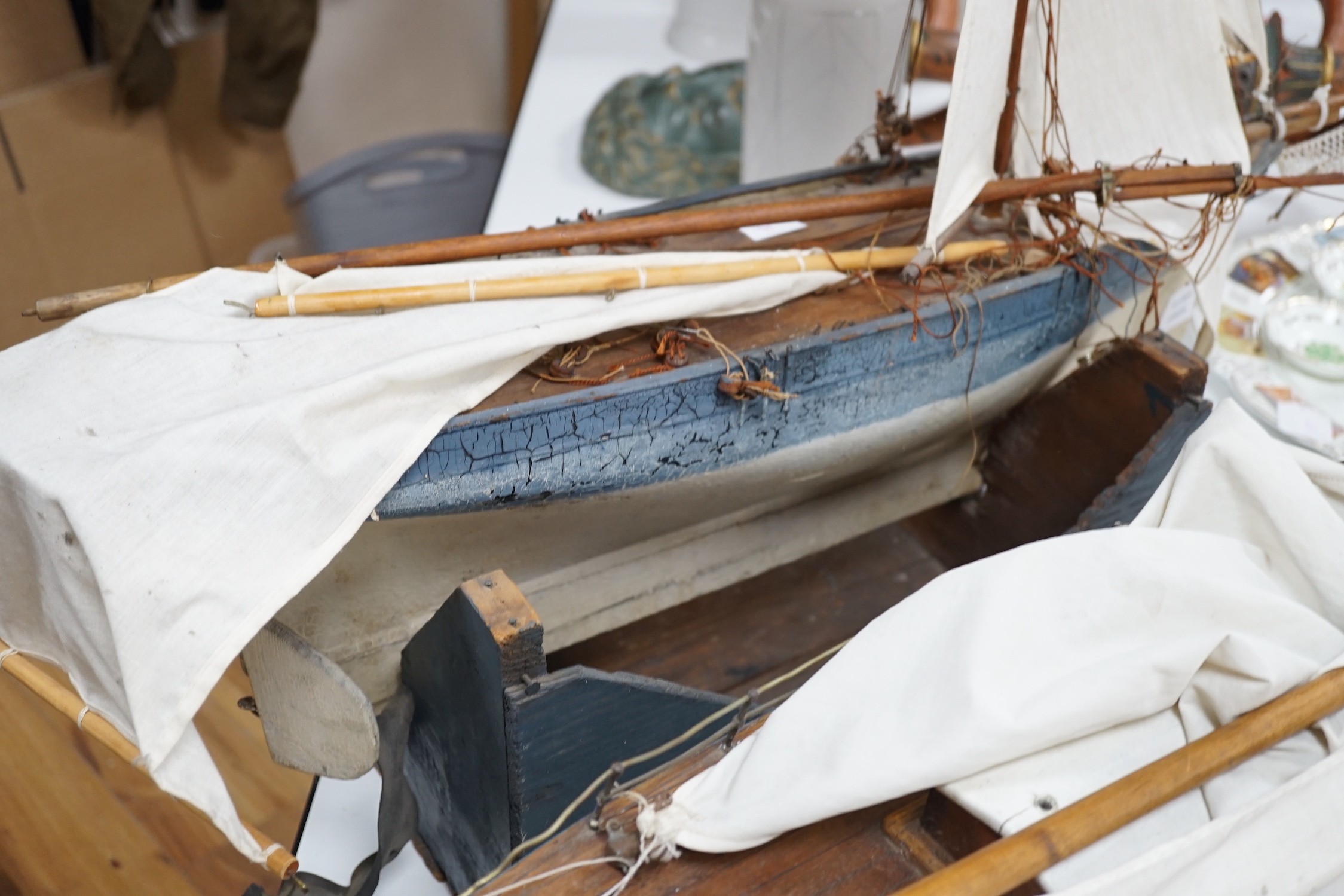 Two large over-painted pond yachts, largest 91cms